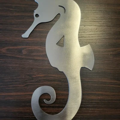 metal wall art of a sea horse