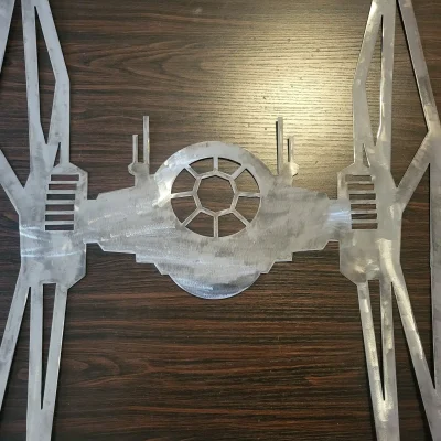 metal wall art of a tie fighter from Star Wars